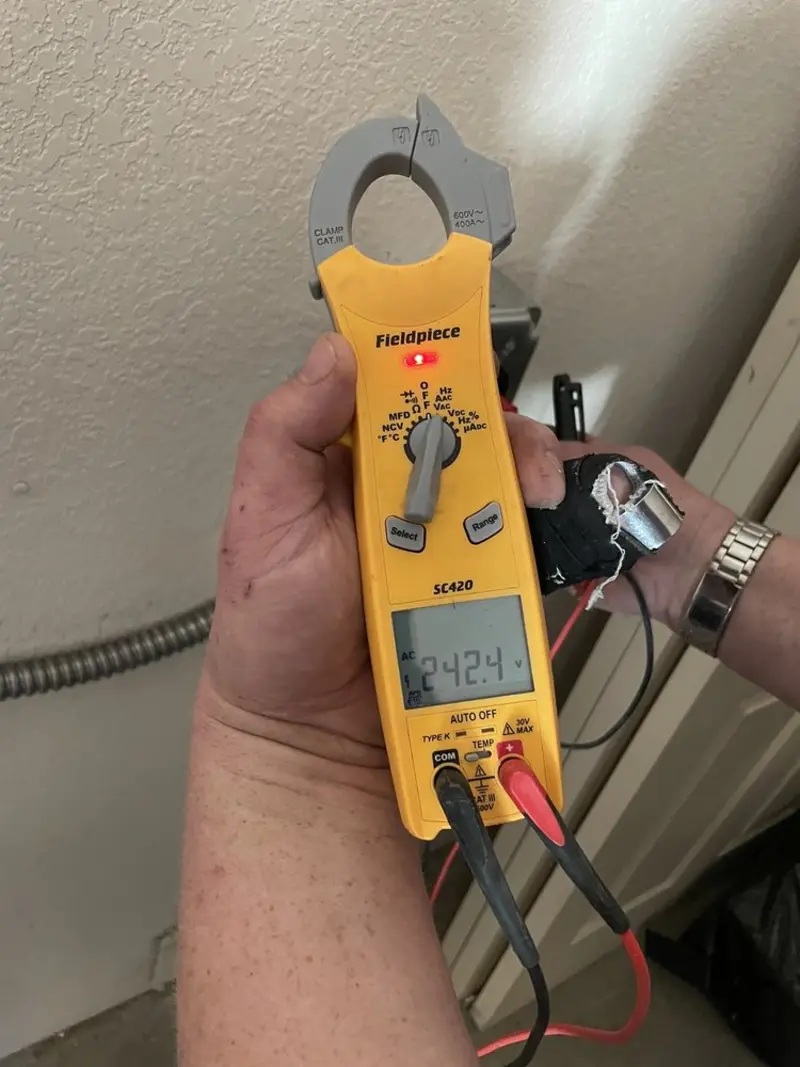 Voltage testing with clamp meter during Whole House Surge Protector in Miles City